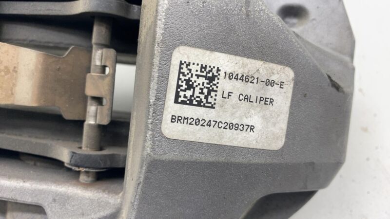 1044621-00-E 17-23 Model 3 Front Driver Side Caliper w/ Brake Hose Line Left LH 1044621-00-E
