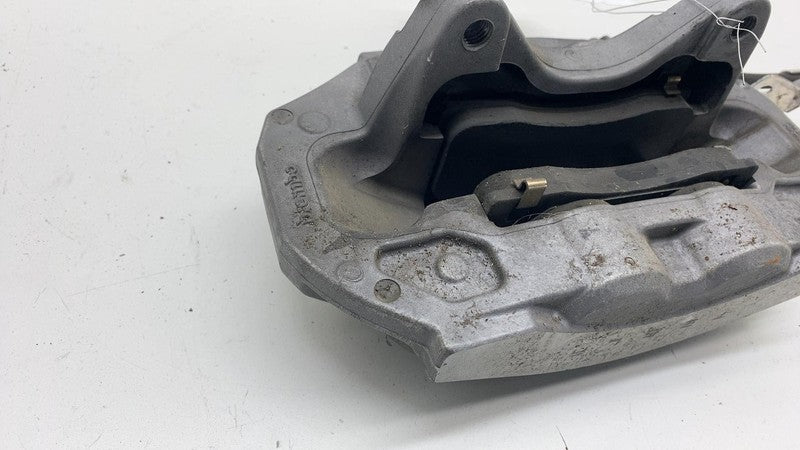 1044621-00-E 17-23 Model 3 Front Driver Side Caliper w/ Brake Hose Line Left LH 1044621-00-E