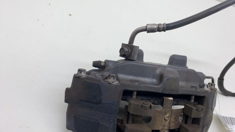 2012-2015 Tesla Model S MS Front Driver Side Caliper w/ Brake Hose Line Left LH