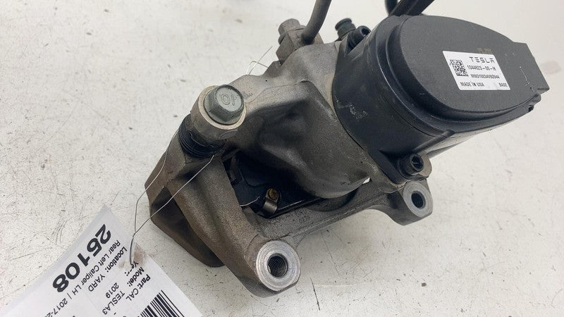 104462300H ⭕ 2017-2025 Tesla Model 3 Rear Left Caliper w/ Brake Line Hose BASE 1044623-00-H