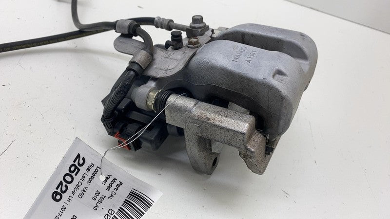⭕ 17-23 Tesla Model 3 Y Rear Left Caliper w/ Brake Line Hose BASE 1044