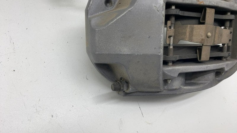 1044621-00-E 17-23 Model 3 Front Driver Side Caliper w/ Brake Hose Line Left LH 1044621-00-E