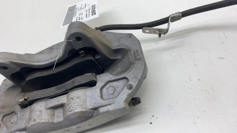 1044621-00-E 17-23 Model 3 Front Driver Side Caliper w/ Brake Hose Line Left LH 1044621-00-E