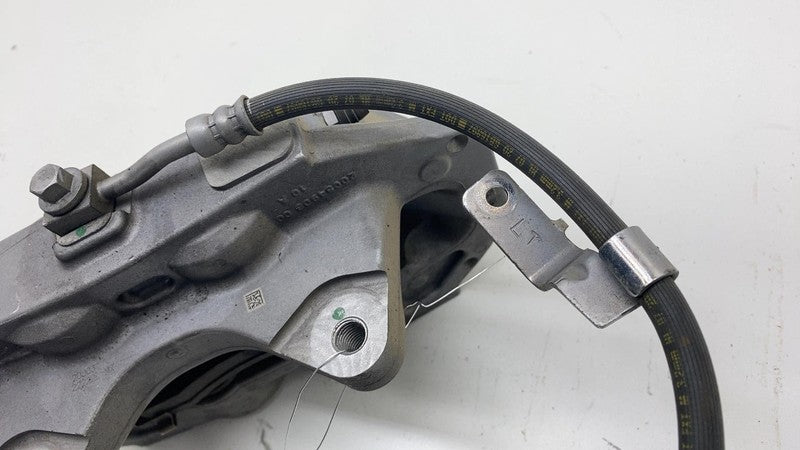 1044621-00-E 17-23 Model 3 Front Driver Side Caliper w/ Brake Hose Line Left LH 1044621-00-E