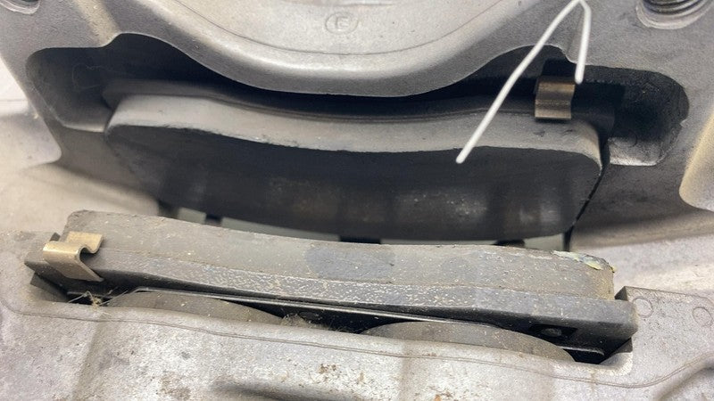 1044621-00-E 17-23 Model 3 Front Driver Side Caliper w/ Brake Hose Line Left LH 1044621-00-E