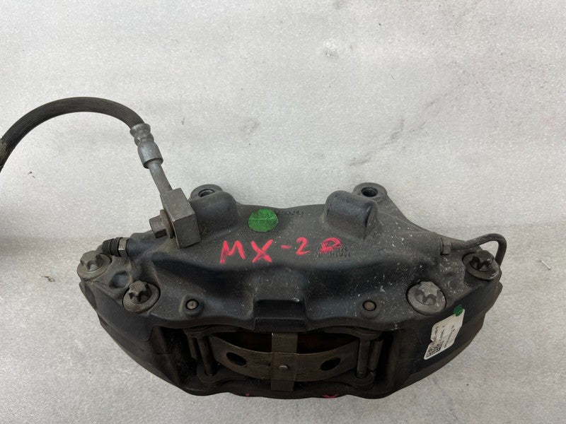 102762100D ⭕16-20 Model X MX Front Driver Side Caliper w/ Brake Hose Line Left 1027621-00-D