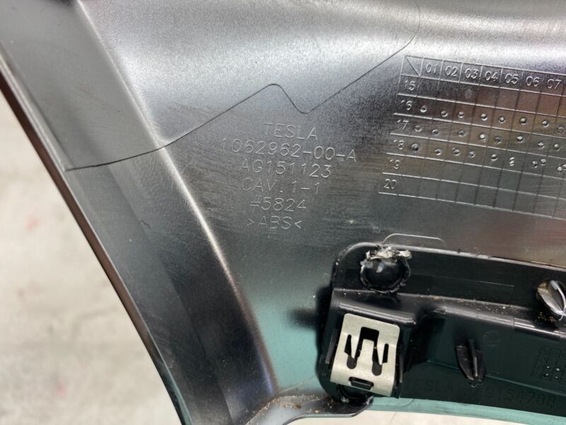 106296200A 2016-2020 Tesla Model X MX Rear Left 2nd Row Monopost Seat Cover Trim Outer OEM