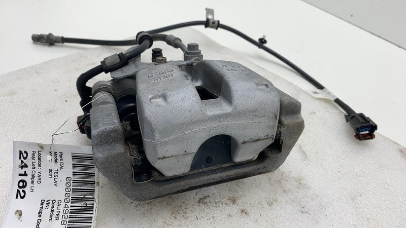 1044623 2017-2024 Tesla Model 3 Y Rear Driver Side Caliper w/ Brake Line Hose Left Assy
