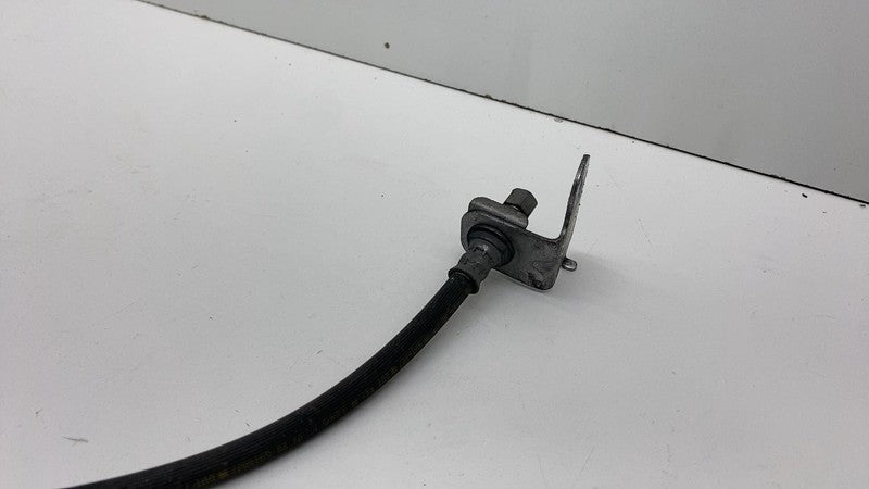 1044621-00-E 17-23 Model 3 Front Driver Side Caliper w/ Brake Hose Line Left LH 1044621-00-E