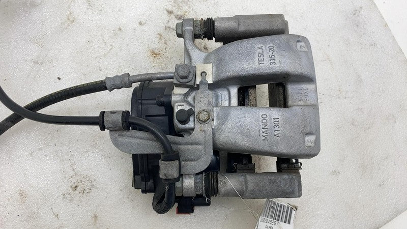 1044623 2017-2024 Tesla Model 3 Y Rear Driver Side Caliper w/ Brake Line Hose Left Assy