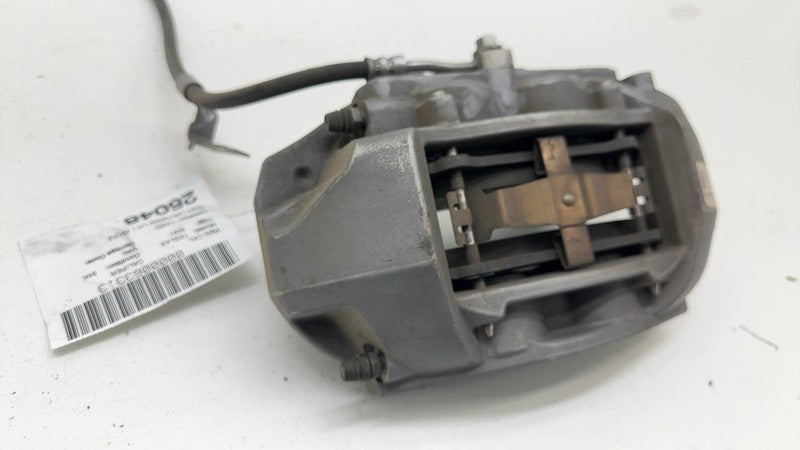 104462100E ⭕ 2017-2023 Tesla Model 3 Front Left Caliper w/ Brake Hose Line LH 1044621-00-E
