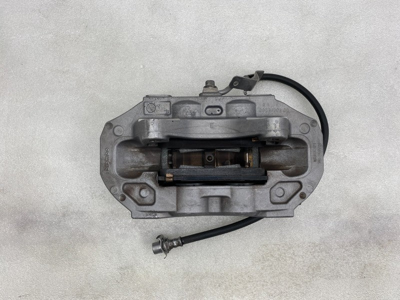 104462100D ⭕ 2017-2023 Model 3 Front Left Caliper w/ Brake Hose Line Left Base 1044621-00-D