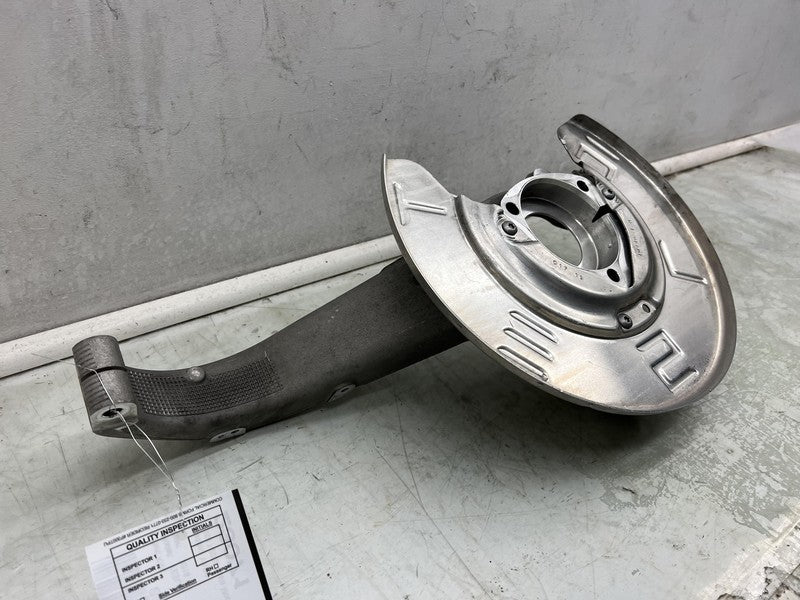 1044661-B 2017-2023 Tesla Model 3 Front Driver Side Spindle Knuckle Rotor Shield Left RWD