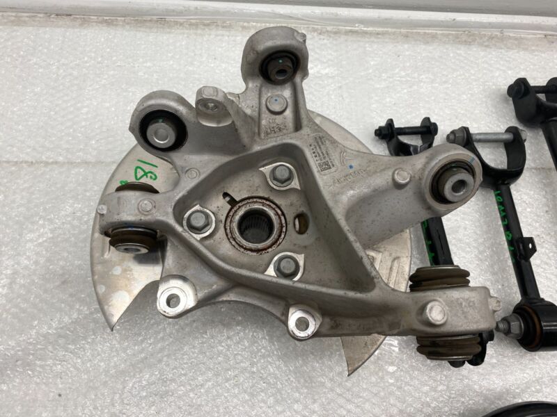 2017-2023 Tesla Model 3 Rear Left Knuckle Wheel Hub Fore Toe AFT Link Spring OEM