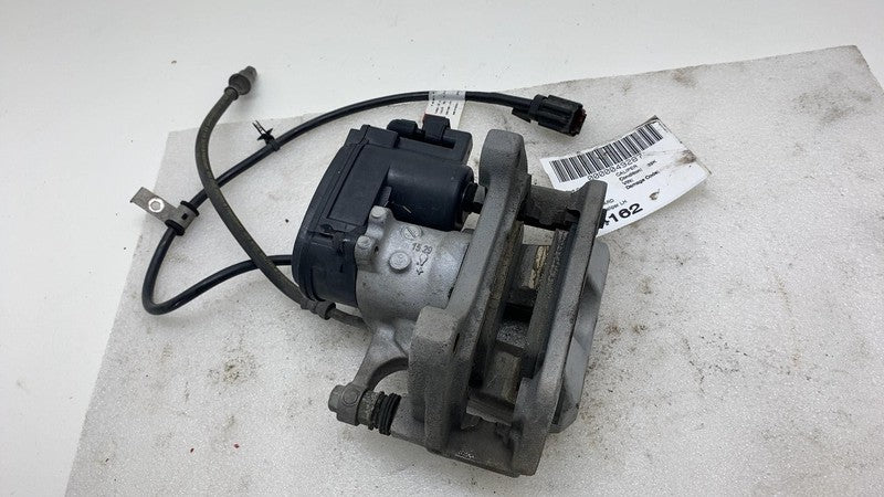 1044623 2017-2024 Tesla Model 3 Y Rear Driver Side Caliper w/ Brake Line Hose Left Assy