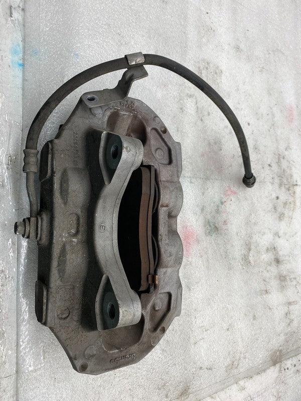 104462100D ⭕ 2017-2023 Model 3 Front Left Caliper w/ Brake Hose Line Left Base 1044621-00-D