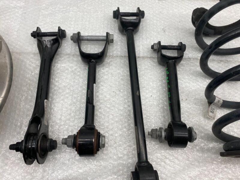 104441100F 2017-2023 Tesla Model 3 Rear Left Knuckle Wheel Hub Fore Toe AFT Link Spring OEM