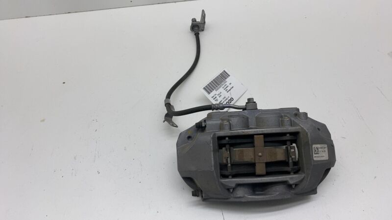 1044621-00-E 17-23 Model 3 Front Driver Side Caliper w/ Brake Hose Line Left LH 1044621-00-E